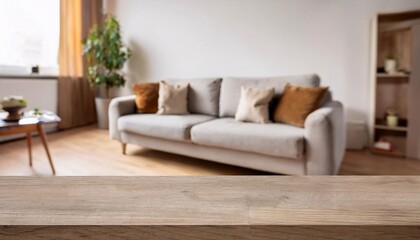 Fototapeta premium Blurred view of light living room with sofa and soft bench; unfocused background photo; selective focus 