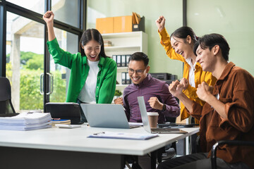 Group of Young Asian business team creative businesspeople coworker in office Happy to be successful partnership teamwork success concept.