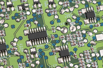 Circuit board with resistors microchips and electronic components background. Computer hardware...