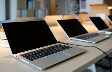 Laptops on a table in a co-working space