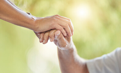 Doctor, patient and holding hands in closeup for support, care or kindness in consultation at clinic. People, nurse and help with empathy for recovery, rehabilitation and health services in hospital