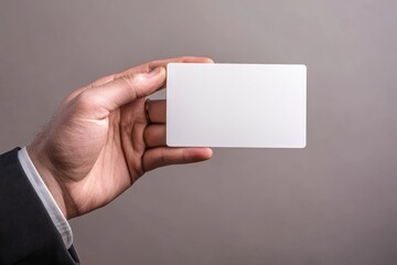 A blank white card mockup with rounded corners. A plain call card mock up template held by a holding arm. A plastic credit card display front. A check offset card design. Business branding.
