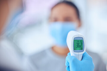 Healthcare, doctor and hand with thermometer for test, hospital or clinic checkup. Consultation, temperature and woman patient with medical professional for pandemic protection for covid compliance