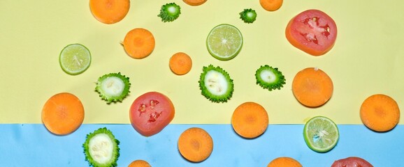 Fresh organic healthy fruits and vegetables decorated on colourful background with panoramic crop