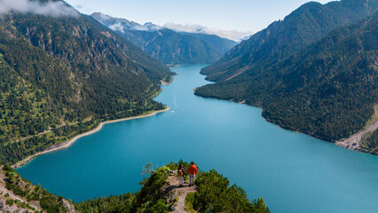 Stunning overlook of Plansee Lake in Austria with hikers enjoying a breathtaking landscape