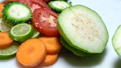 Fruits salad slice with knife on chopping board