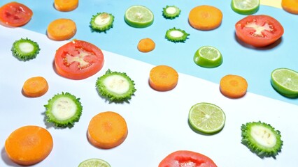 Fresh organic healthy fruits and vegetables decorated on colourful background