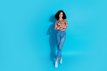 Photo of lovely pretty woman wear trendy print clothes look empty space isolated on blue color background