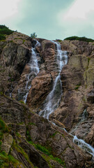 Cloudy summer morning over the largest waterfall in Poland. Siklawa Waterfall in the Polish Tatra Mountains.