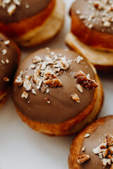 Homemade delicious donuts with chocolate and nuts