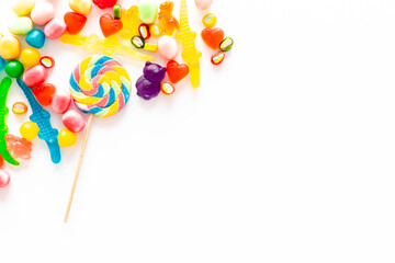 Food pattern. Sweets and candies background. Many different lollipops top view