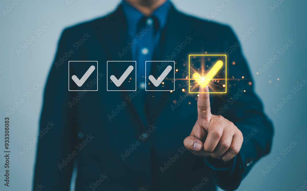 Poster Businessman ticking checkmark on a box in the list Show on the virtual screen. Checklist Ideas in Business Survey items and questionnaires. copy space