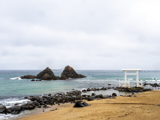 A tranquil view of Sakurai Futamigaura in Japan, featuring the iconic 