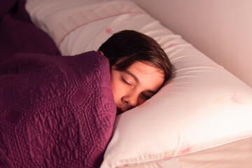 Child Sleeping in Bed with Soft Light