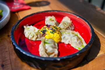 Fried Chinese gedza with mango mousse and chipotle pepper