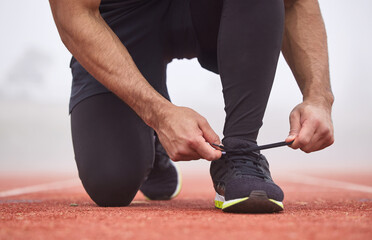 Man, shoe tie and start in outdoor stadium for running, challenge and training at sport and fitness...