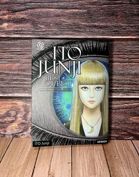 Jakarta, Indonesia - August 22th, 2024 - Junji Ito comic best of best short stories collection front book manga cover isolated on wooden table surface background.