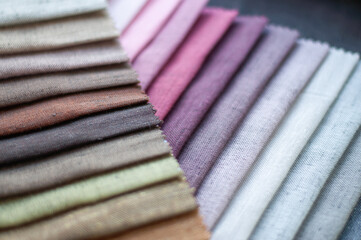 Palette of pink and beige colors of fabrics for curtains. Samples of fabrics for curtains.