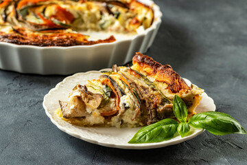 Vegetable tart with zucchini, eggplant and carrots. Pie with baked vegetables.