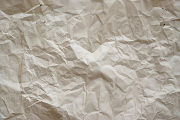 Obraz premium Craft crumpled paper, cardboard background. Brown kraft sheet texture, torn antique page, wallpaper or parchment abstract design, Horizontal rough carton