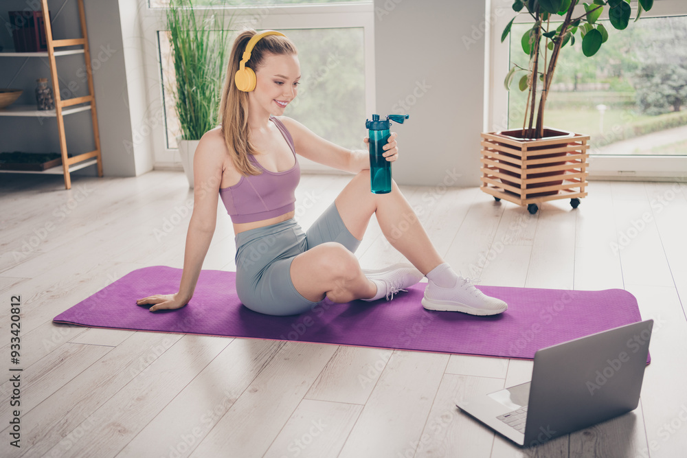 Wall mural Photo of lovely adorable active energetic girl training at home gym physical exercises house indoors