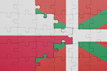 puzzle with the colourful national flag of basque country and flag of poland.