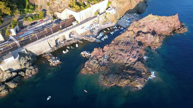 Europe, Italy, Framura is a little sea village in Liguria close to 5 terre ( five island )  - drone aerial view of mediterranean coast - natural harbour and beach 
