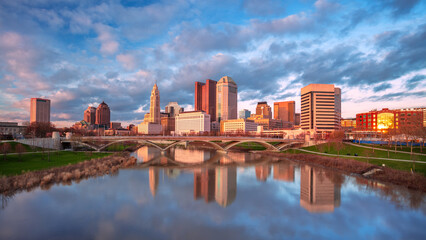 Columbus, Ohio, USA. Cityscape image of Columbus, Ohio, USA downtown skyline with the reflection of the city in the Scioto River at spring sunset.