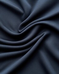 A close-up view of dark fabric with smooth, flowing texture, perfect for fashion or interior design projects.