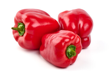 Red ripe bell peppers, isolated on white background.