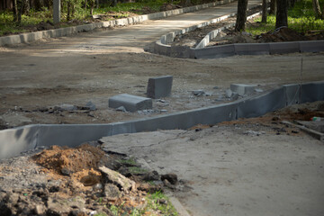 Road repair. Laying asphalt. Installation of curbstone.