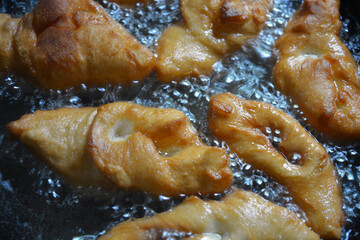 Food, homemade food, cooking delicious food. Ukrainian national cuisine, fried verguntsi in hot...