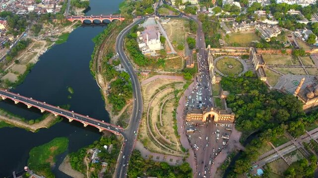  Aerial view of bada Imambara complex on city road with rumi darwaza Islamic architecture built by nawab asaf-ud-daulain 1784, lucknow, uttar pradesh, India, asia.