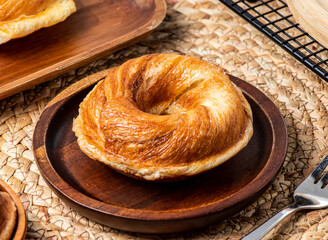 Brown sugar fresh baked donuts served in wooden dish isolated on table side view of taiwan dessert