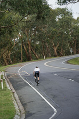 Cyclists ride up the famous Devil's Elbow climb, an hour east of Melbourne, Australia.