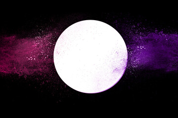 Explosion of colored powder and dust smoke splash pink and purple on black background