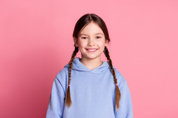 Photo of lovely small schoolkid beaming smile wear hoodie isolated on pink color background