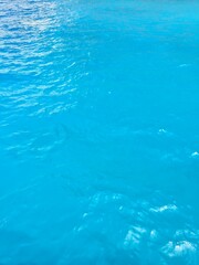 Beautiful blue waters in the Mediterranean Sea off the coast of Navagio Beach in Zakynthos, Greece.