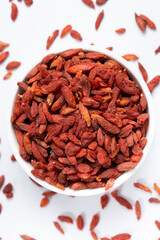 Dried Goji berries Lycium barbarum top view on a white background