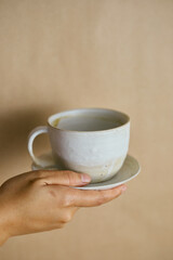 Female hands hold ceramic