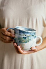 Female hands hold ceramic