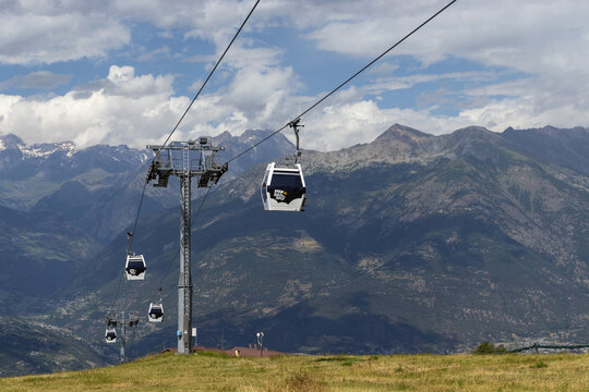AOSTA, ITALY, 2 AUGUST 2024: The Aosta - Pila gondola lift in summer arriving at Pila. Cable cars for 8 people leave from the city center of Aosta and reach in 18 minutes the tourist locality of Pila.