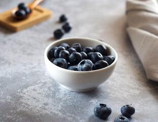 blueberries in a bowl on the table