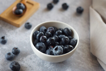 blueberries in a bowl on the table