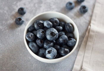blueberries in a bowl on the table