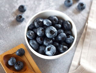 blueberries in a bowl on the table