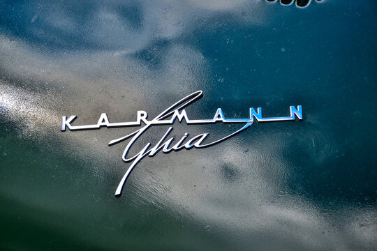 Roche-la-Moli&egrave;re, France - July 2nd 2023 : Car show. Green Volkswagen Karmann Ghia. Focus on the name of the car.