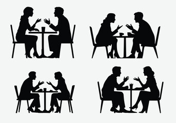 Silhouette of two business people in Deep Conversation at a Caf&eacute; .Businessman and Businesswoman meating silhouette 