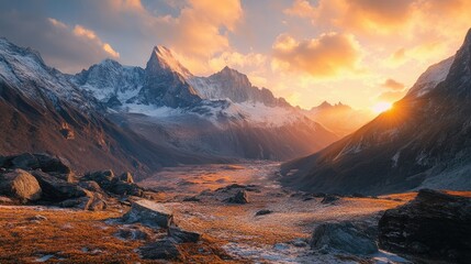 Naklejka premium Sunrise over the Yading Nature Reserve, with golden light illuminating the peaks and casting long shadows across the valleys.