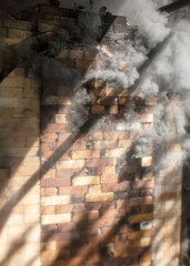 wonderful smoke play ceramic firing kilns, pottery firing, smoke swirls outside the kiln, shadow